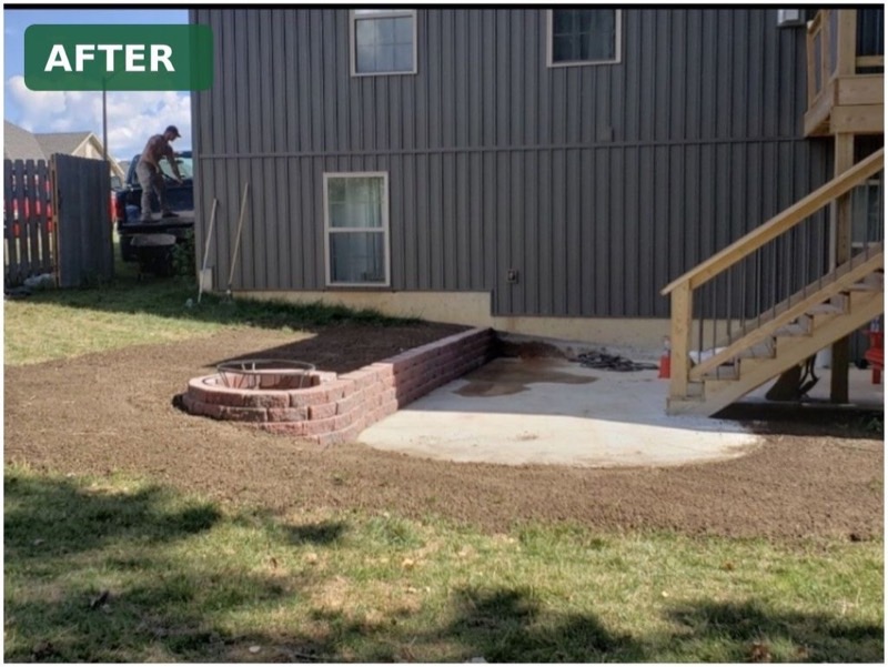 Backyard after concrete tear-out with a new brick paver step